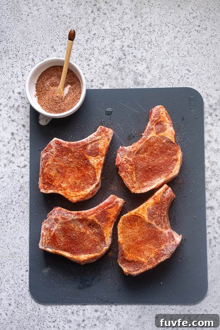 Juicy Oven-Baked Pork Chops with Garlic-Herb Crust 6 Season the pork chops with the sweet and smoky rub.