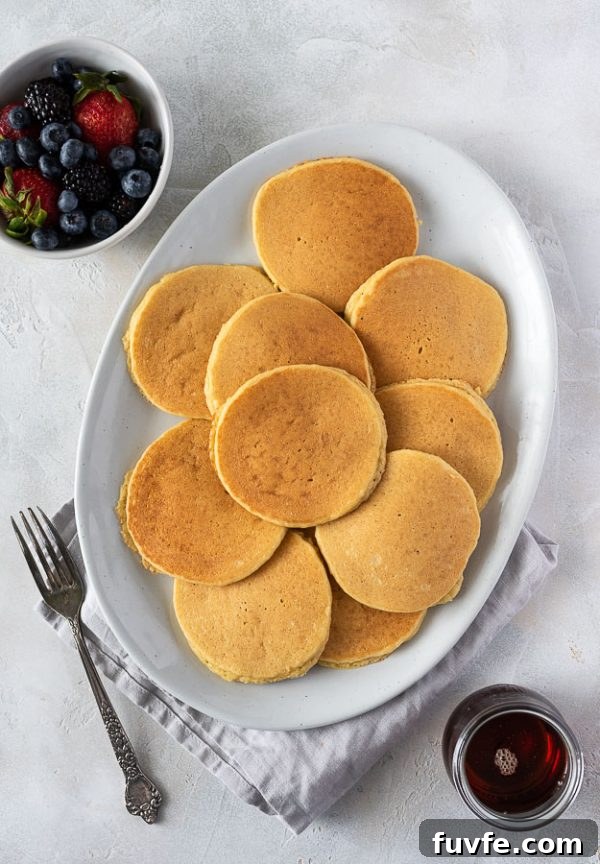Fluffy Almond Flour Pancakes - Gluten-Free Breakfast Recipe 4 almond flour pancakes on a serving platter