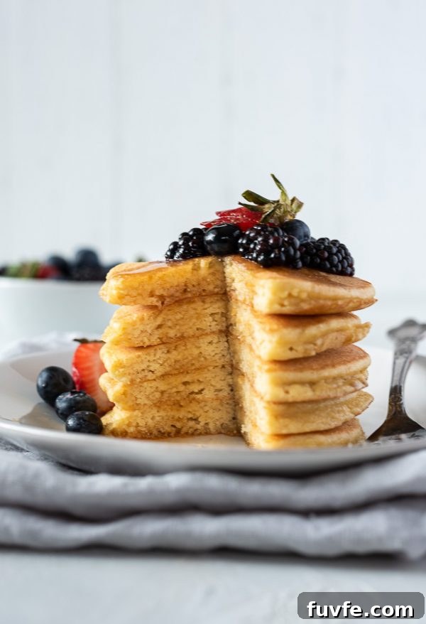Fluffy Almond Flour Pancakes - Gluten-Free Breakfast Recipe 6 close up of almond flour pancakes cut in the middle showing the fluffiness