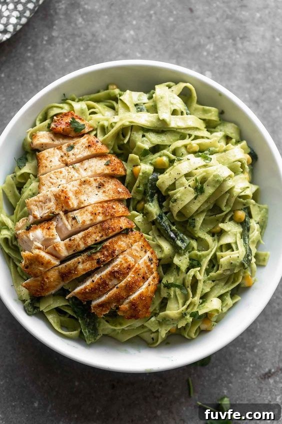 25 Poblano Pepper Recipes with Roasting and Storage Tips 7 Overhead view of a bowl of roasted poblano pasta with sliced chicken.