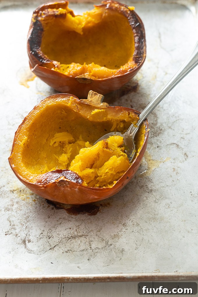 Spoon scooping roasted pumpkin