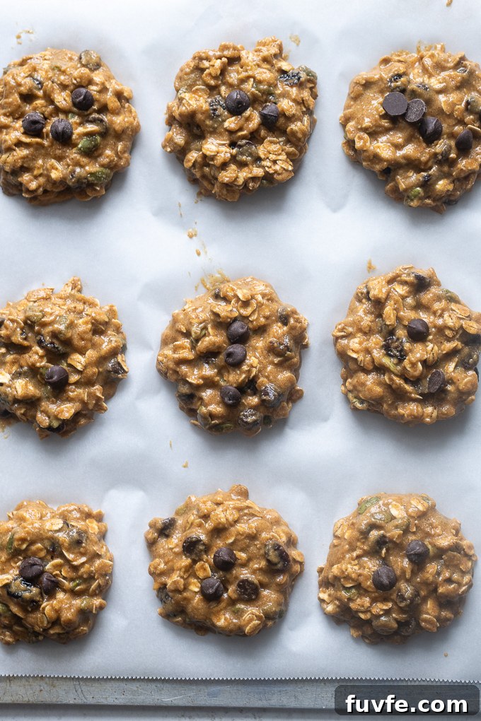 Pumpkin breakfast cookies on baking sheet before baking.