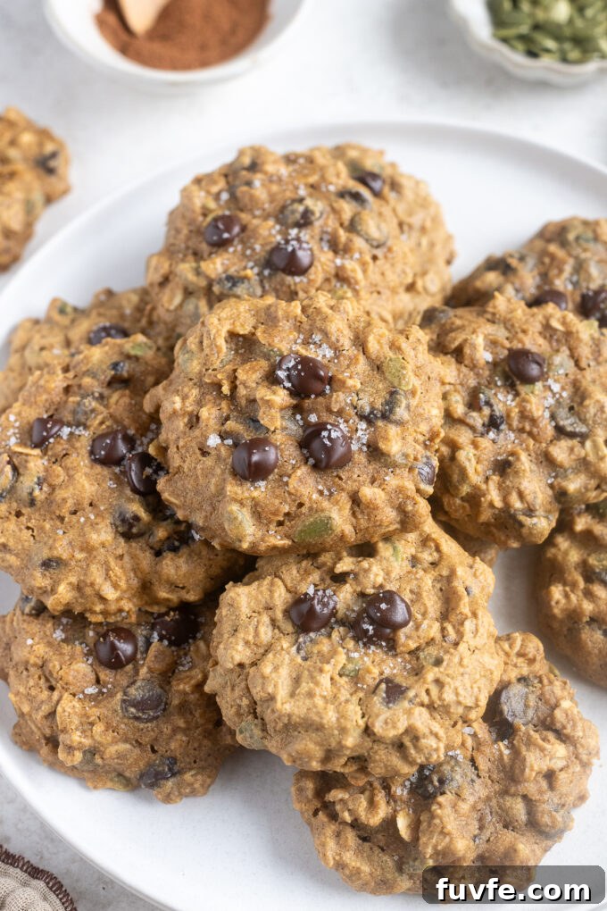 Pumpkin breakfast cookies on a white plate.