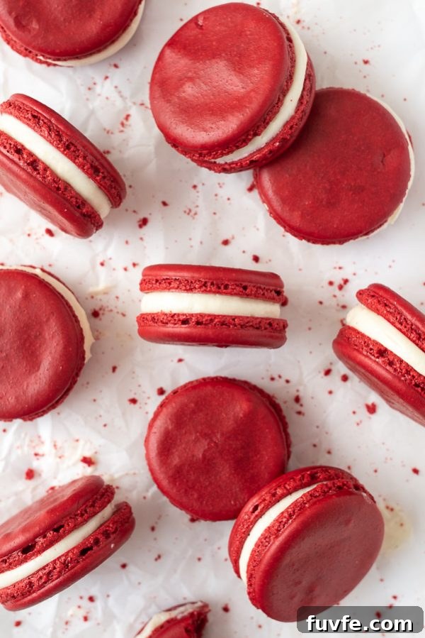 overhead shot of red velvet macarons with cookie crumbs