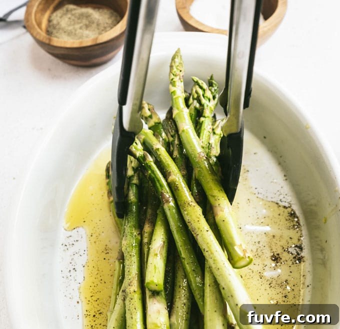 Perfect Grilled Asparagus with Lemon and Garlic 5 lifting asparagus with tongs