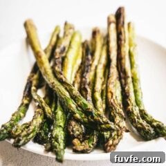 Perfect Grilled Asparagus with Lemon and Garlic 6 A close up of a grilled asparagus