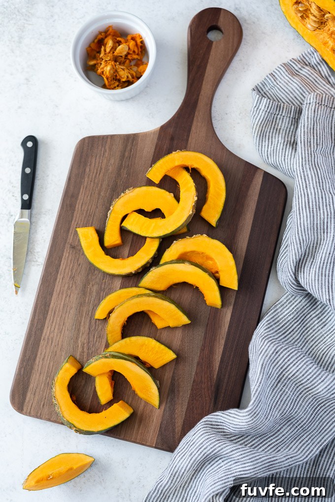 Kabocha squash slices on a cutting board