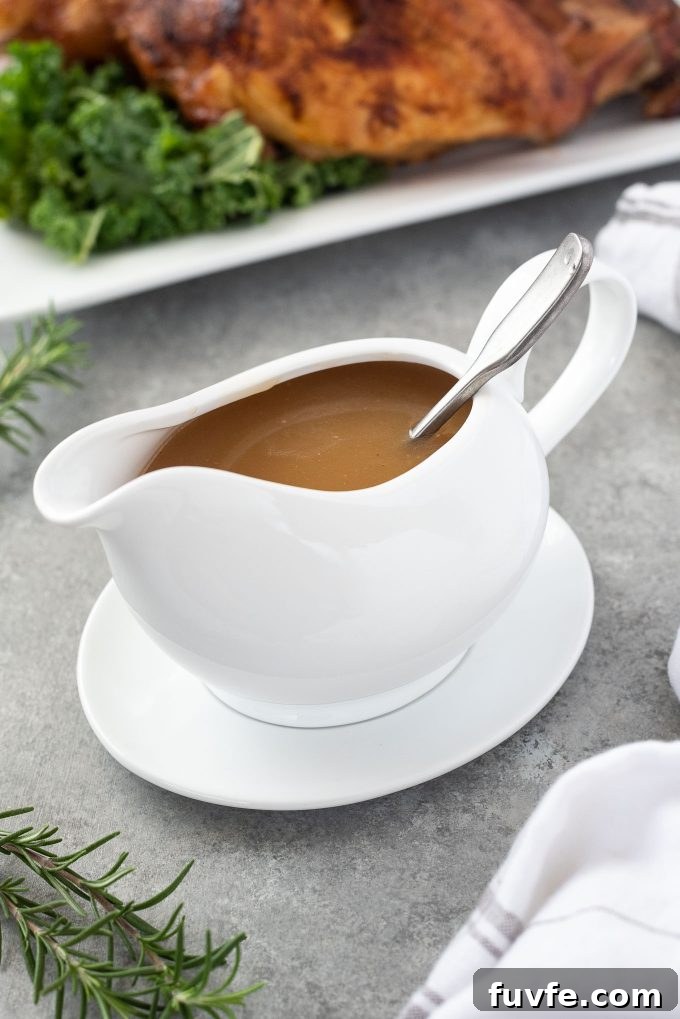 How to Make Turkey Gravy from Pan Drippings 2 Spoon in a boat of turkey gravy