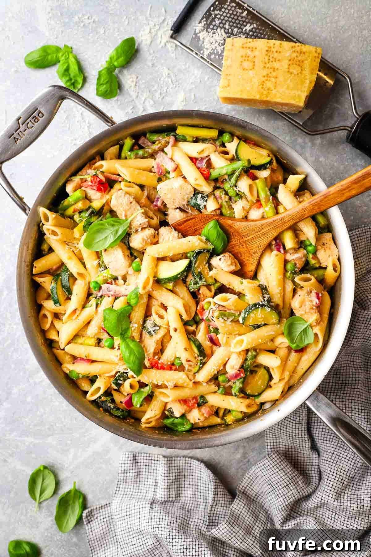 Creamy Chicken Pasta Primavera with Spring Vegetables 11 overhead view of chicken primavera pasta in a skillet