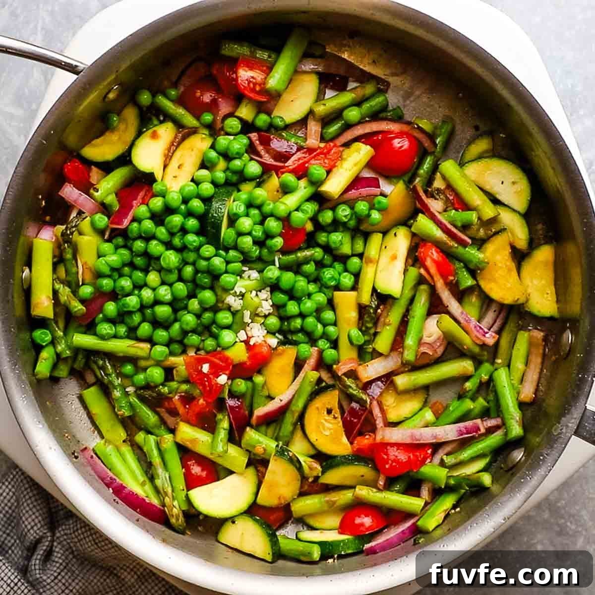 Creamy Chicken Pasta Primavera with Spring Vegetables 8 peas added to the skillet with the veggies
