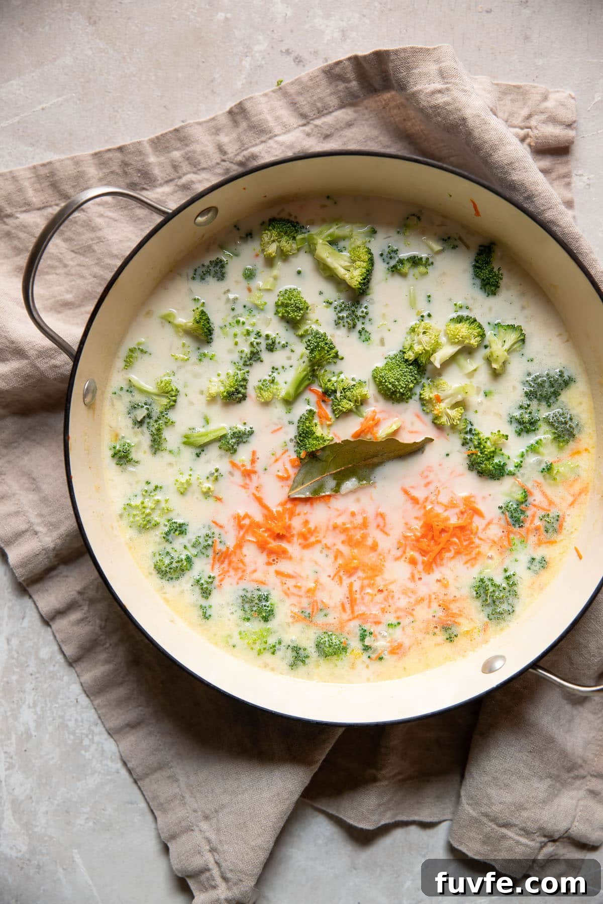 30-Minute Broccoli Cheddar Soup Recipe for Quick Comfort 8 carrots broccoli in a pot with broth