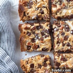 Irresistible Magic Cookie Bars Recipe - Seven Layer Bars 7 Magic cookie bars cut into squares.
