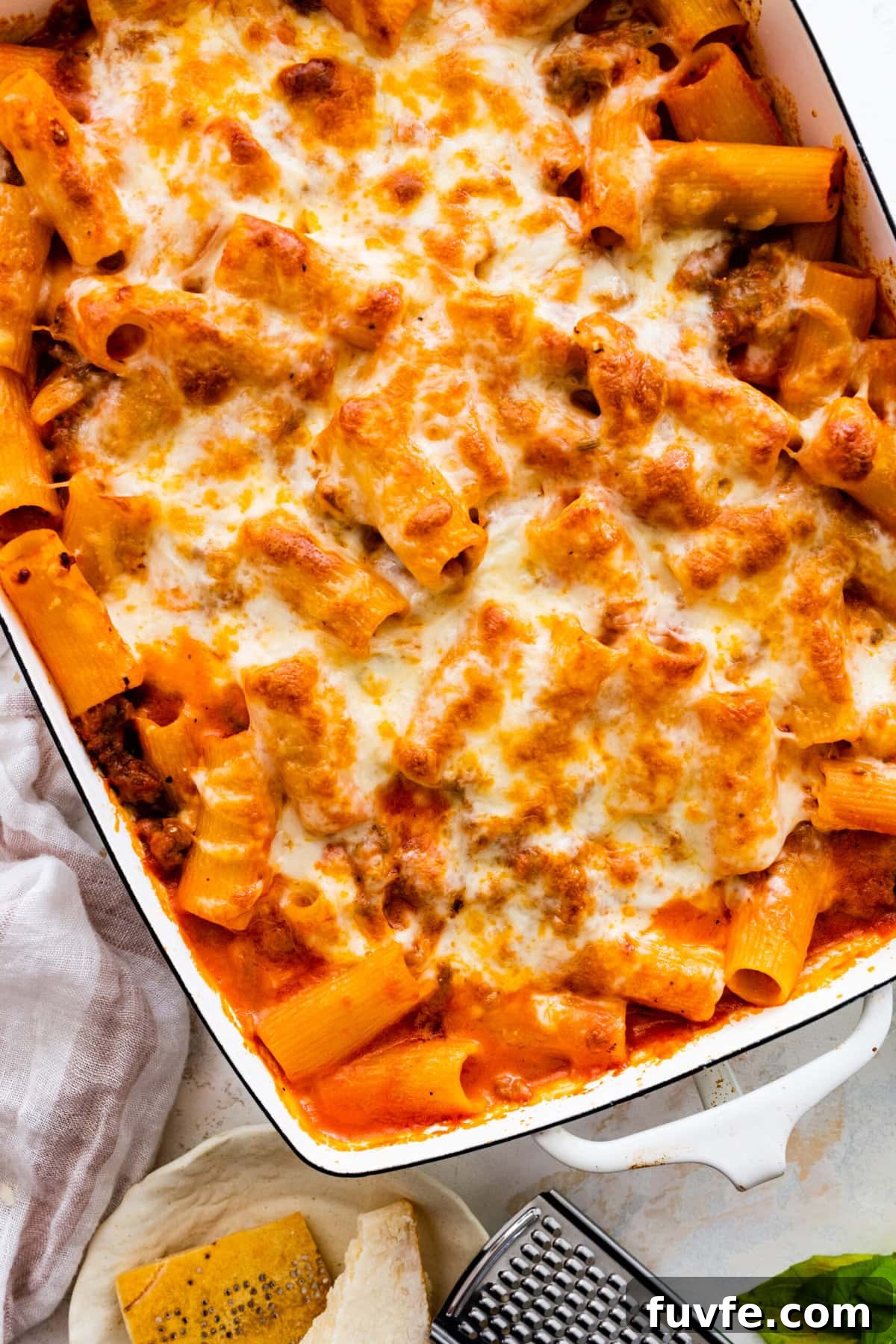 baked cheesy classic pasta al forno recipe out of the oven in a white baking pan.