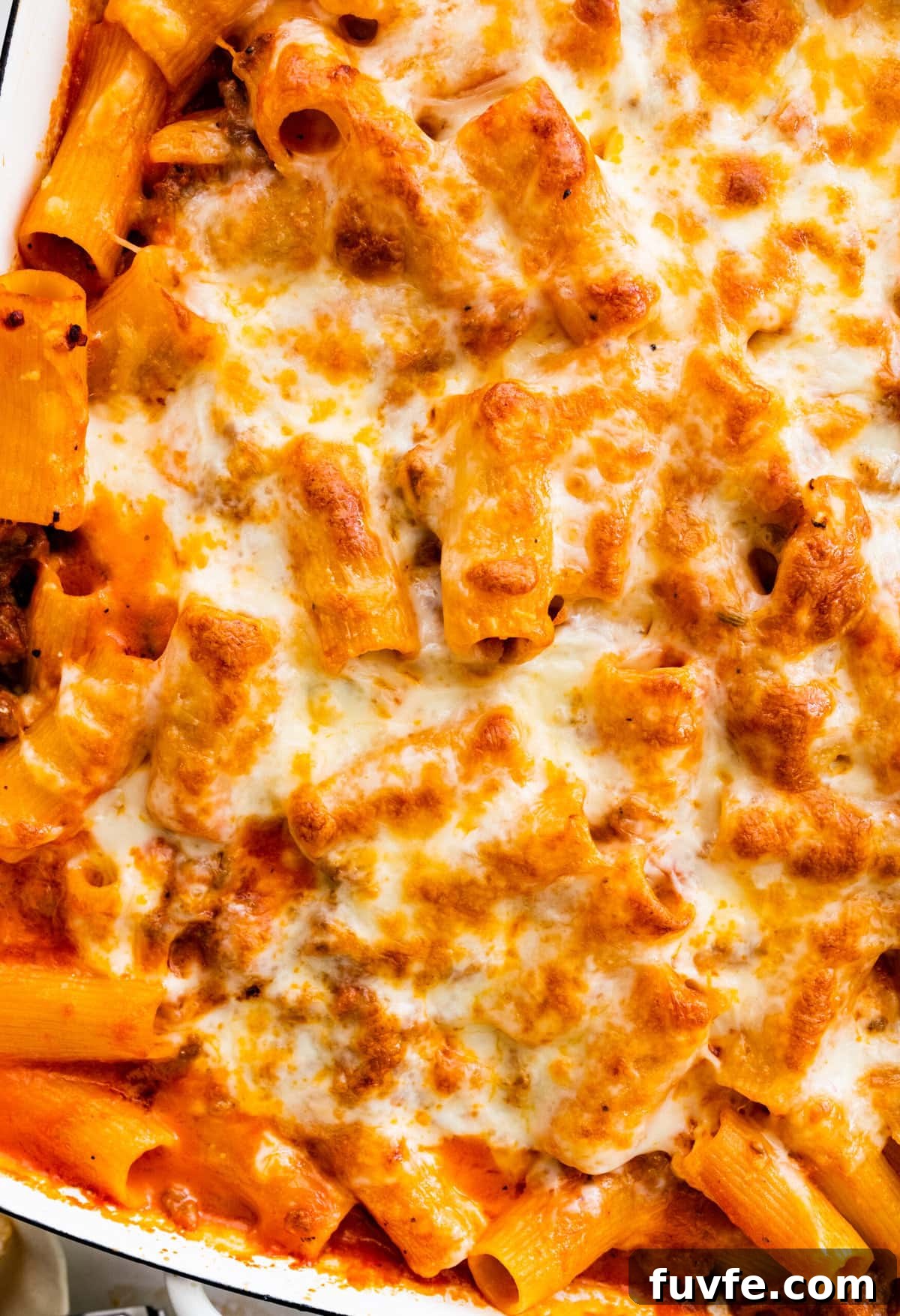 baked cheesy classic pasta al forno recipe out of the oven in a white baking pan.
