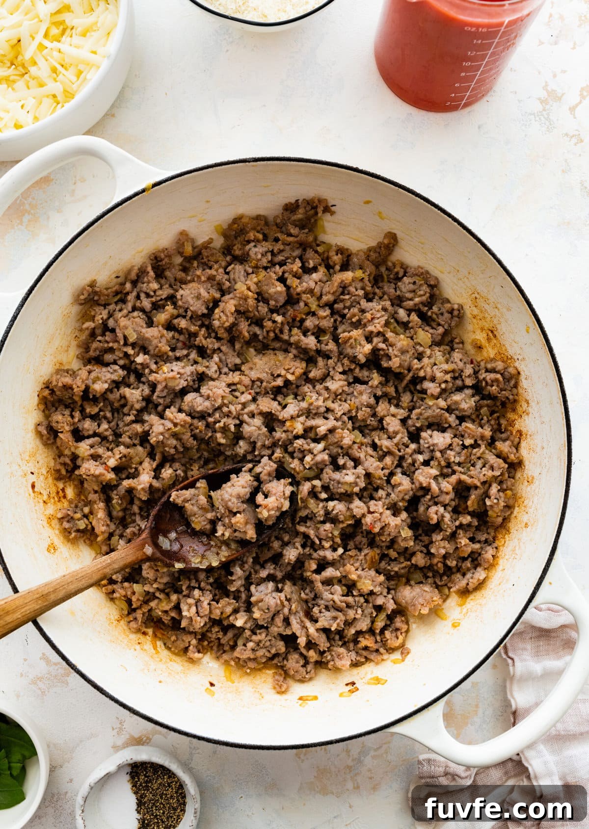 How to make classic pasta al forno step-by-step: browning the meat in the pan.