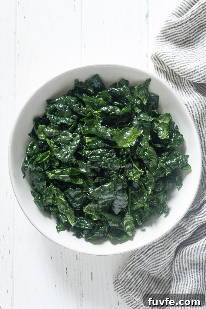 Massaged kale in a white bowl