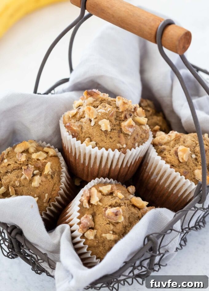 Moist Banana Oat Flour Muffins Recipe 6 Banana oat flour muffins in a basket.
