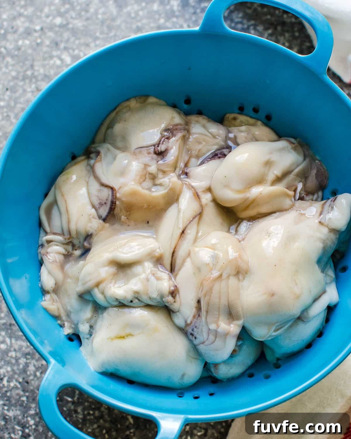 Traditional Oyster Stew Recipe: Creamy New England Style 2 Draining oysters in a colander.
