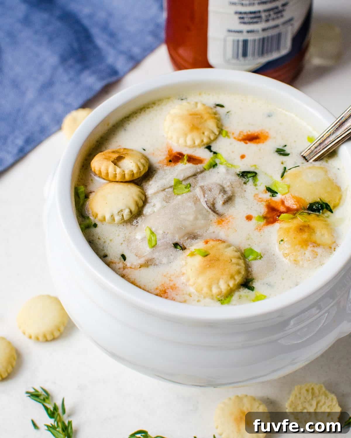 Traditional Oyster Stew Recipe: Creamy New England Style 11 A bowl of hearty oyster stew with hot sauce.