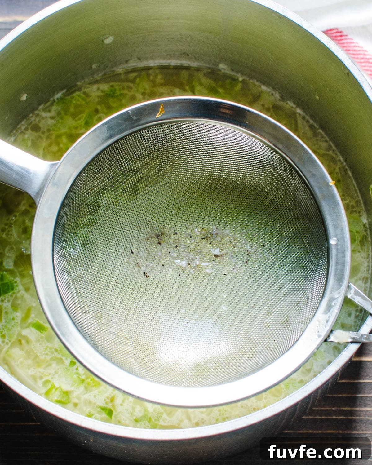 Traditional Oyster Stew Recipe: Creamy New England Style 6 Straining oyster liqueur into the vegetables.