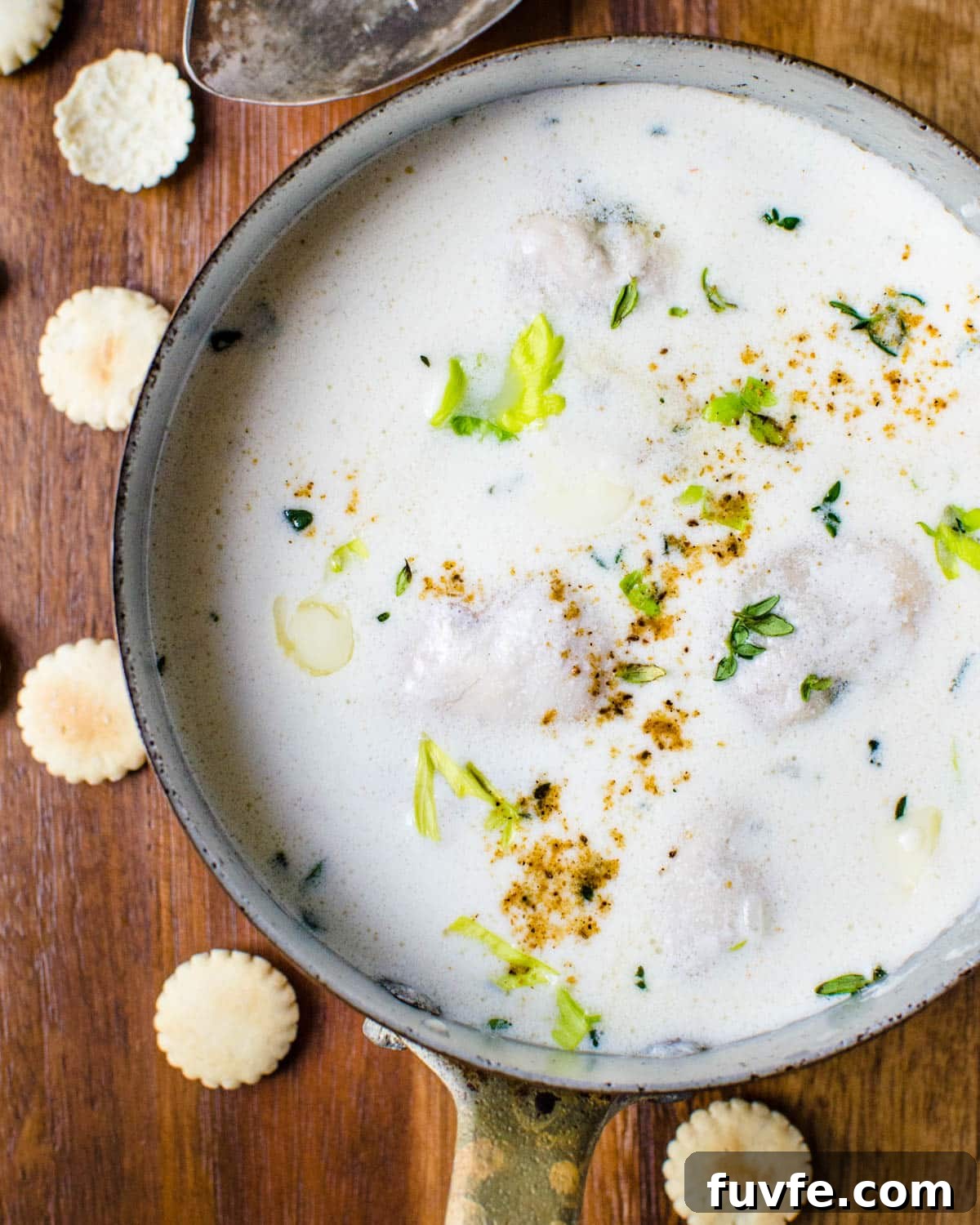 Traditional Oyster Stew Recipe: Creamy New England Style 9 A pot of oyster stew with oyster crackers.
