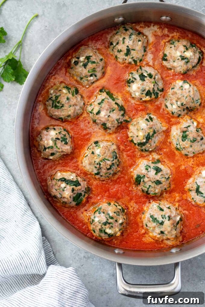 Oven Baked Turkey Meatballs in a skillet with marinara sauce