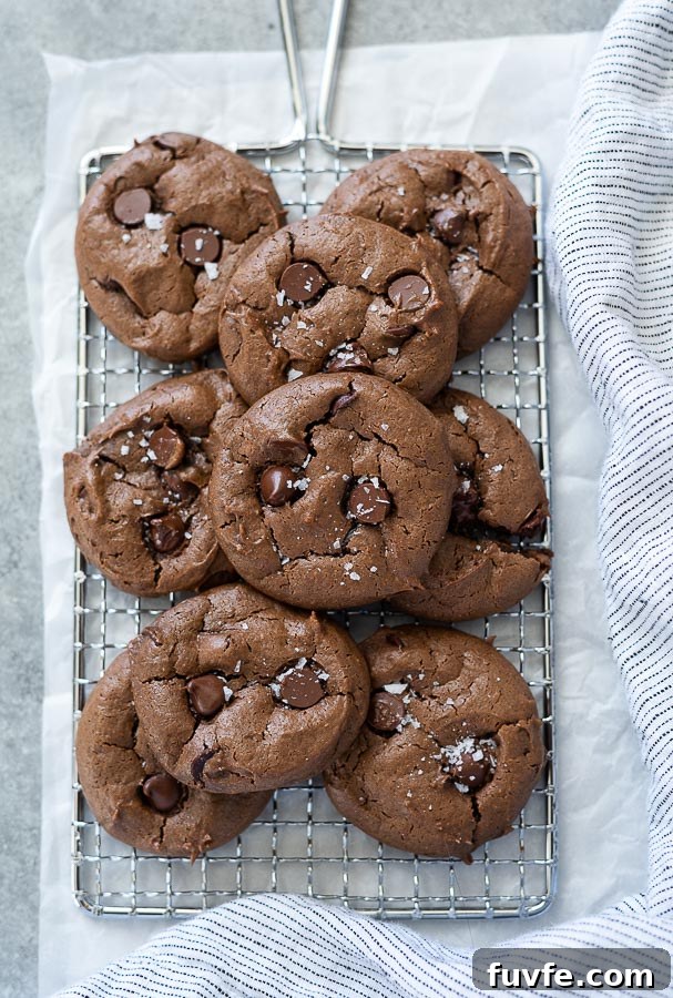 overhead shot of gluten free chocolate peanut butter cookies piled on wire rack