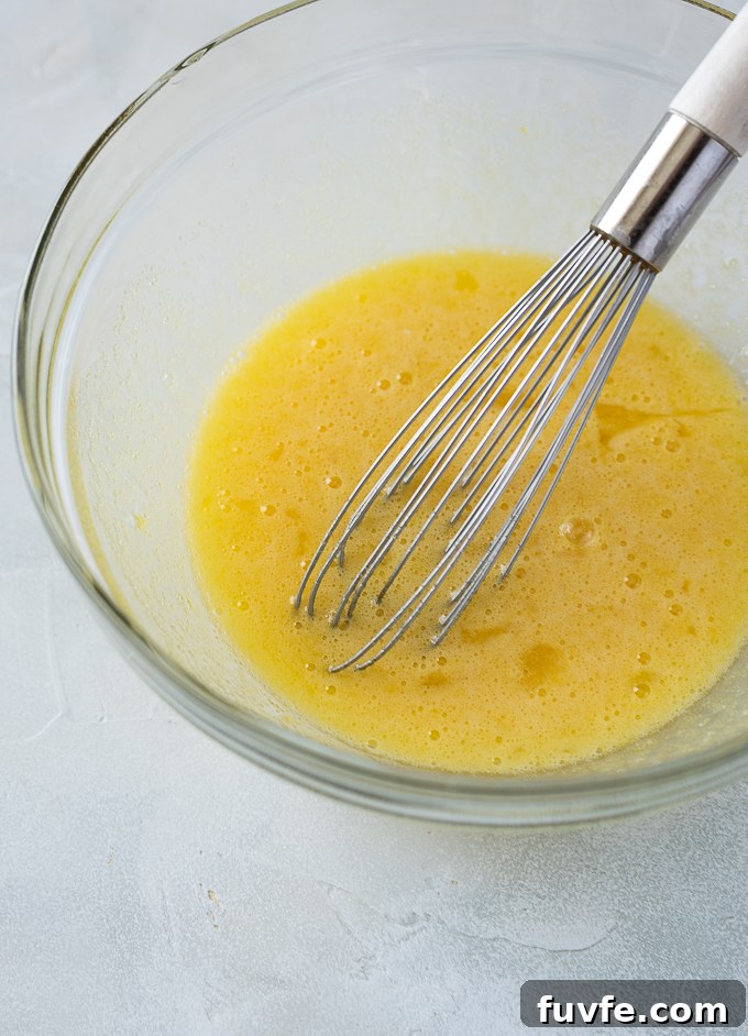 Zesty Key Lime Shortbread Bars Recipe 6 Whisk eggs and sugar for key lime bar filling.