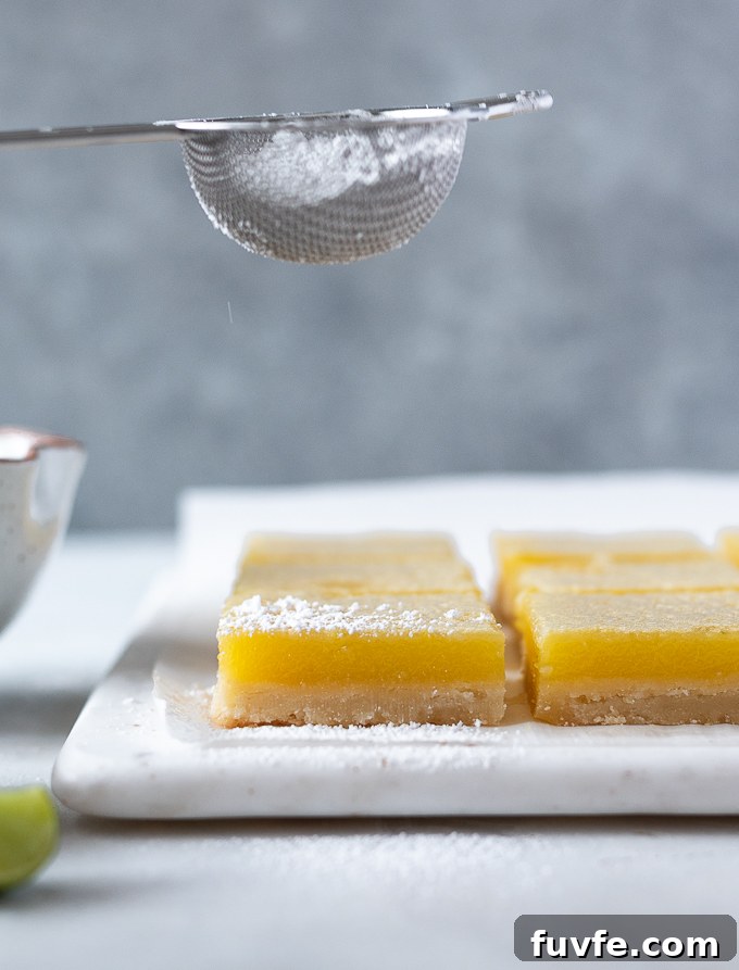 Zesty Key Lime Shortbread Bars Recipe 9 Dust cooled key lime shortbread bars with powdered sugar.