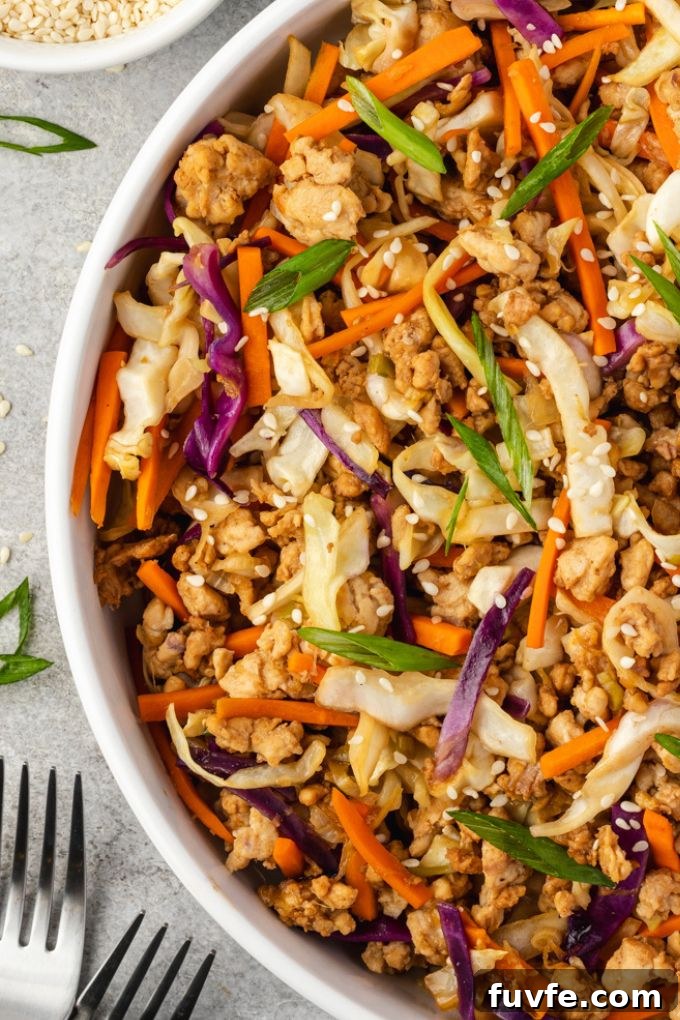 Egg Roll Bowl Recipe: Asian-Style Stir-Fry 8 Egg roll bowl in white bowl with forks alongside