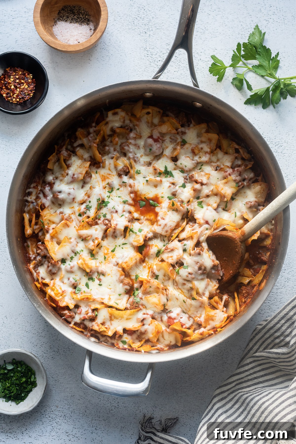 Cabbage and ground beef casserole in a skillet with cheese.