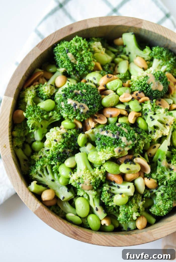 A bowl of food with broccoli, with Peanut and Salad