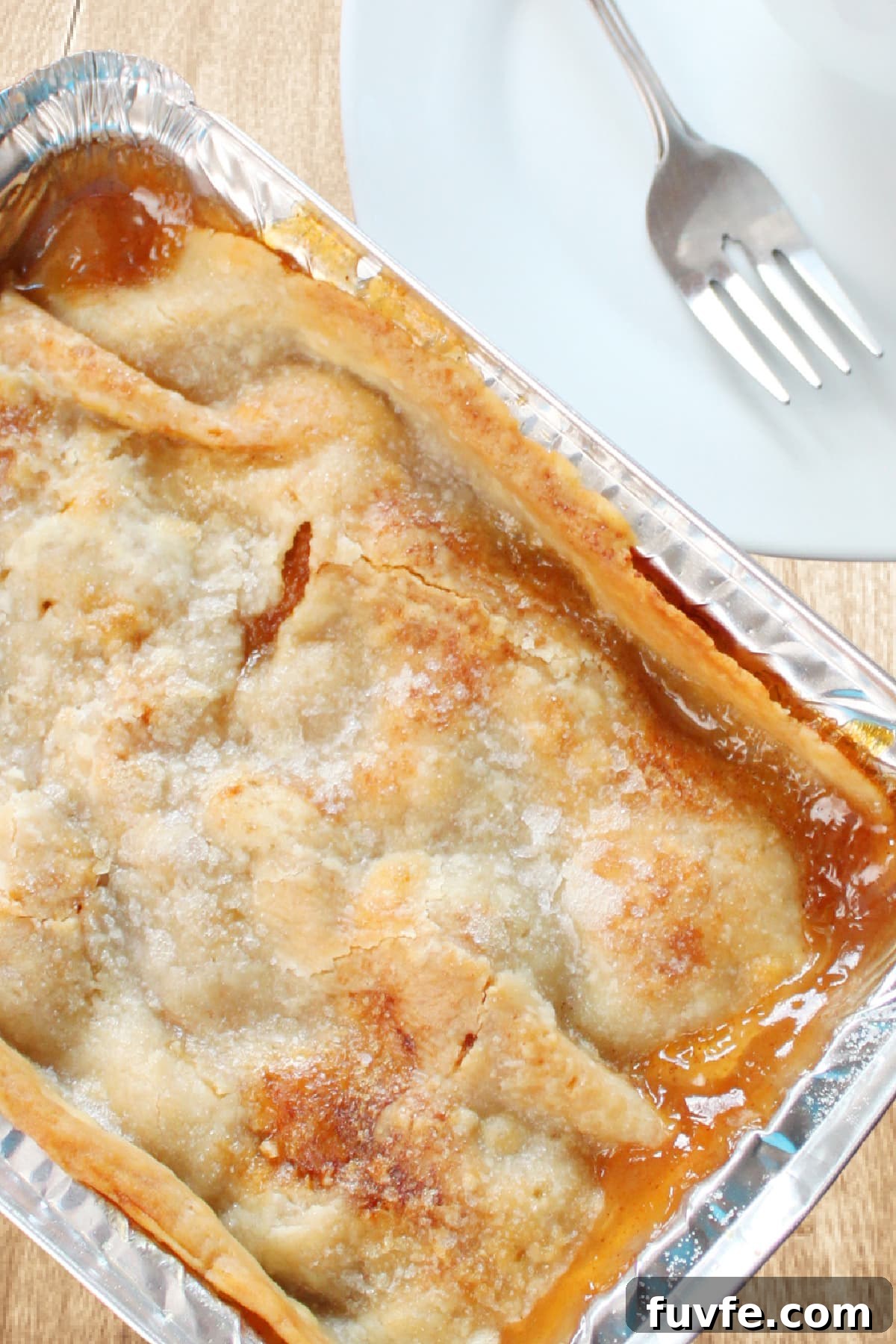 peach cobbler in metal pan