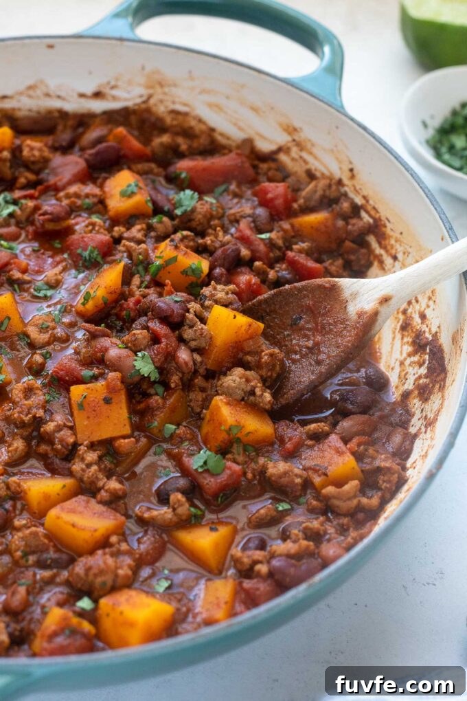 Hearty Butternut Squash and Turkey Chili 3 Turkey chili with butternut squash in a Dutch oven.