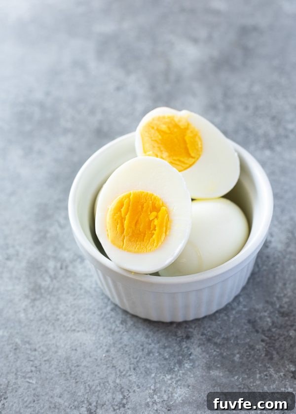 How to Make Perfect Hard-Boiled Eggs Every Time 3 hard boiled eggs in a ramekin