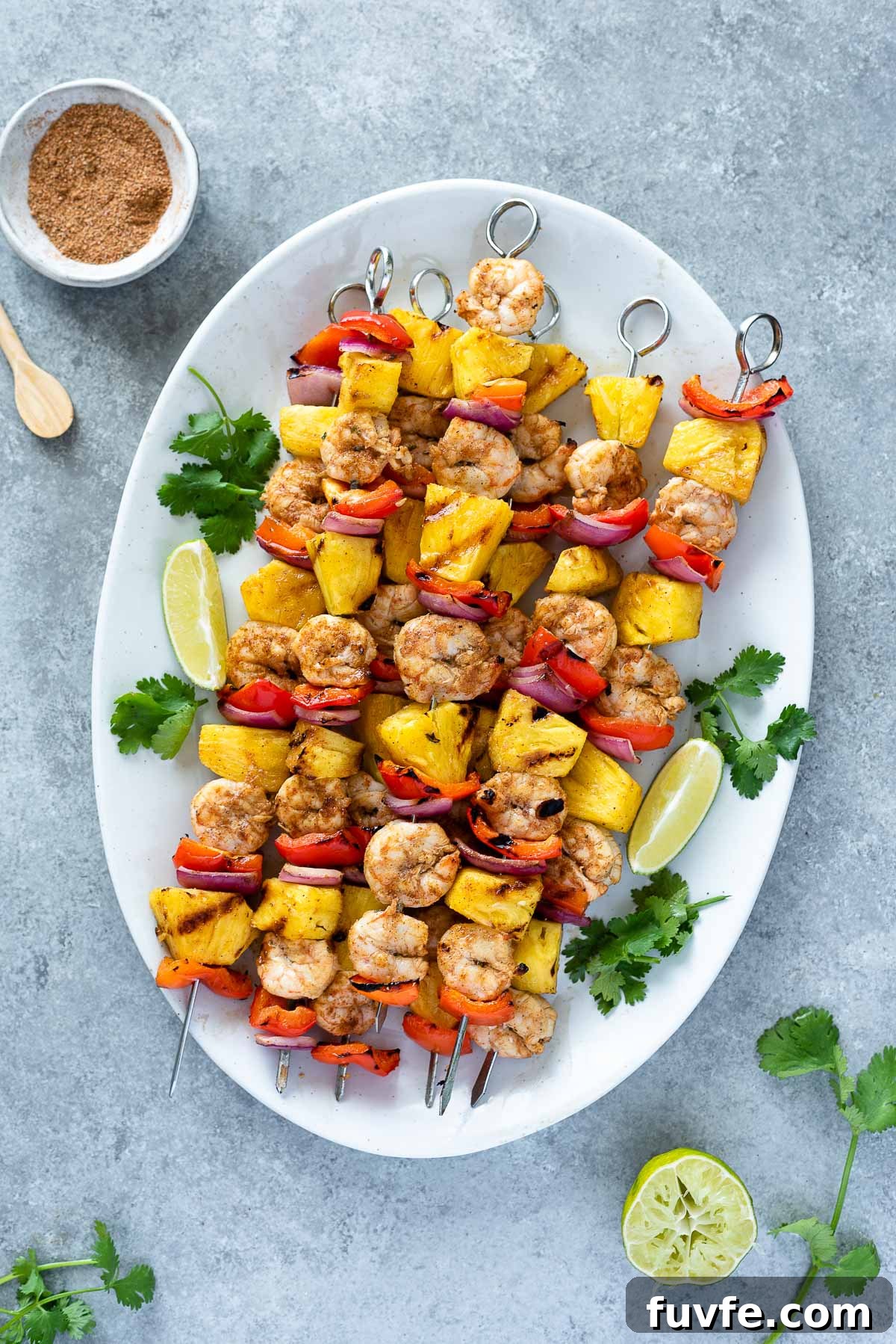 Grilled Jerk Shrimp and Pineapple Skewers 2 overhead shot of shrimp pineapple skewers on a serving platter