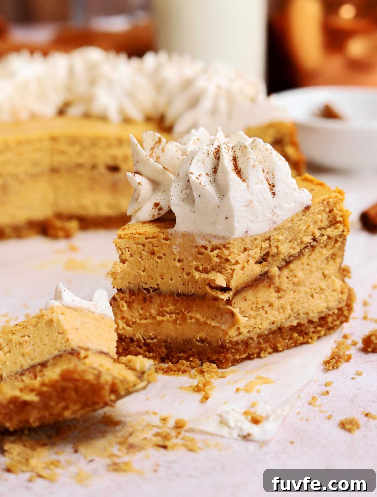 cinnamon swirl pumpkin cheesecake with bite