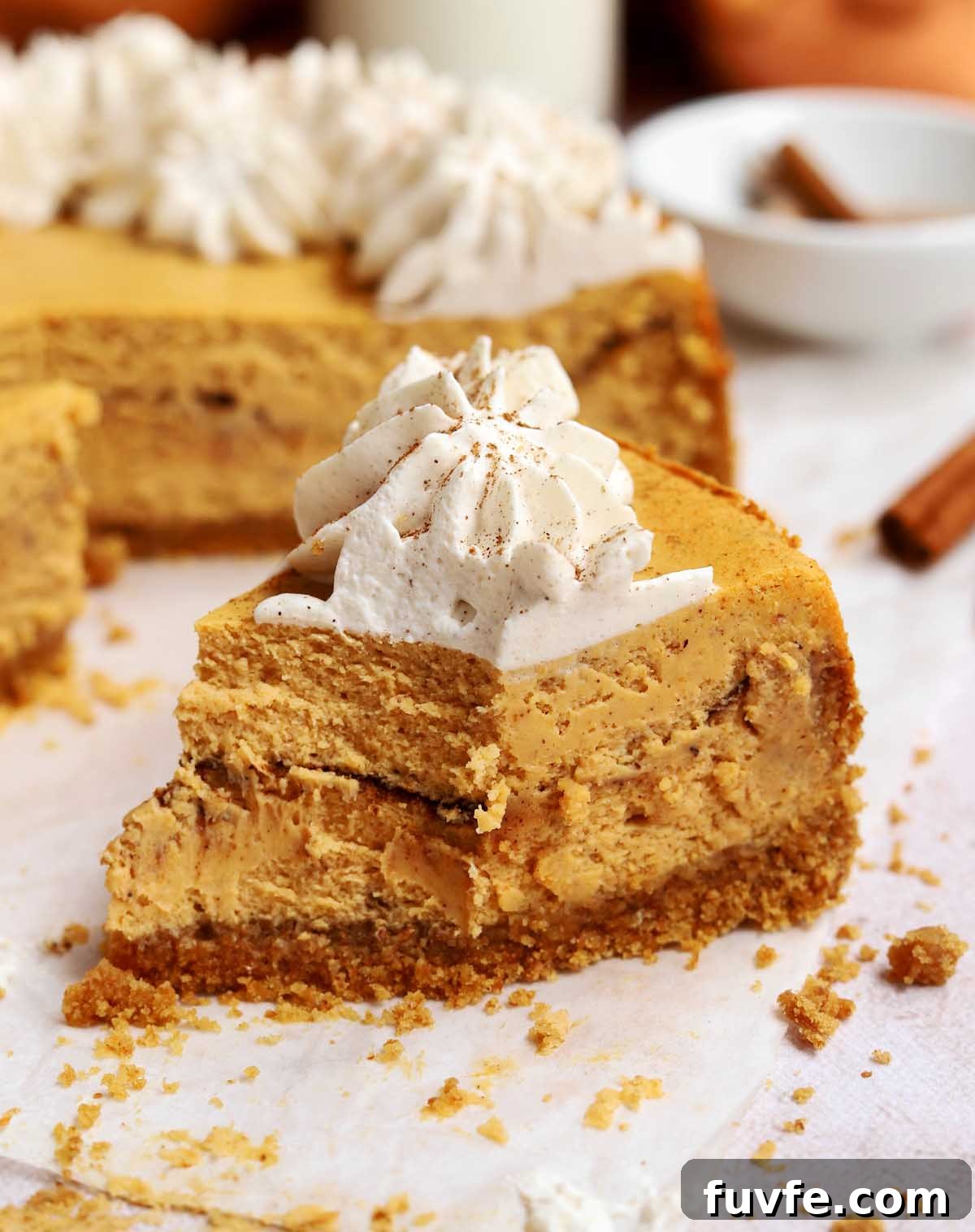 cinnamon swirl pumpkin cheesecake with bite