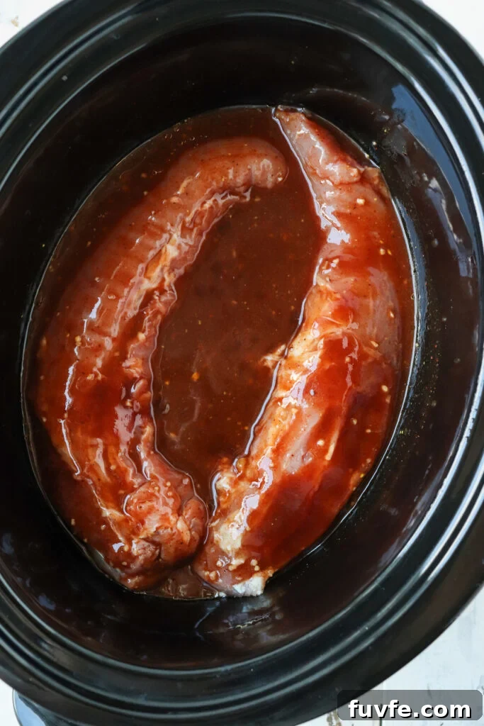 pork tenderloin in bbq sauce in a crockpot