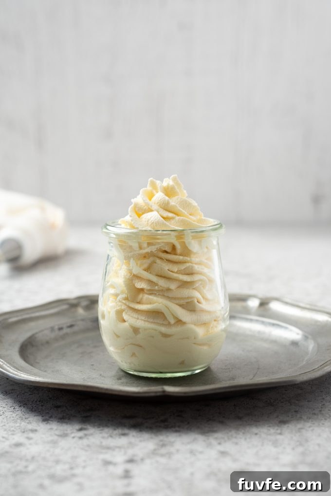 How to Make Homemade Whipped Cream for Stable, Fluffy Results 2 Homemade whipped cream piped in a jar