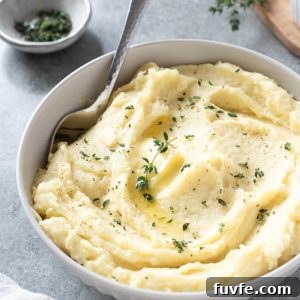 How to Make Creamy Parsnip Puree 8 Parsnip puree in a white bowl with serving spoon digging in