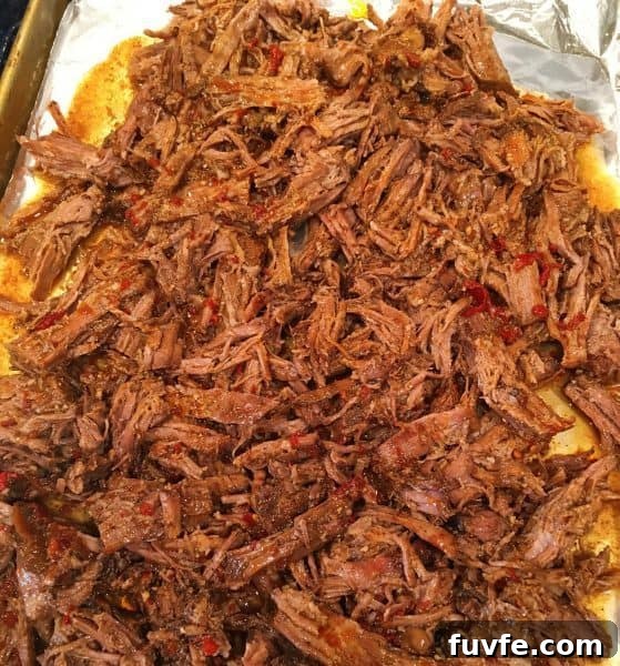 Beef Barbacoa on a cookie sheet toasted in the oven