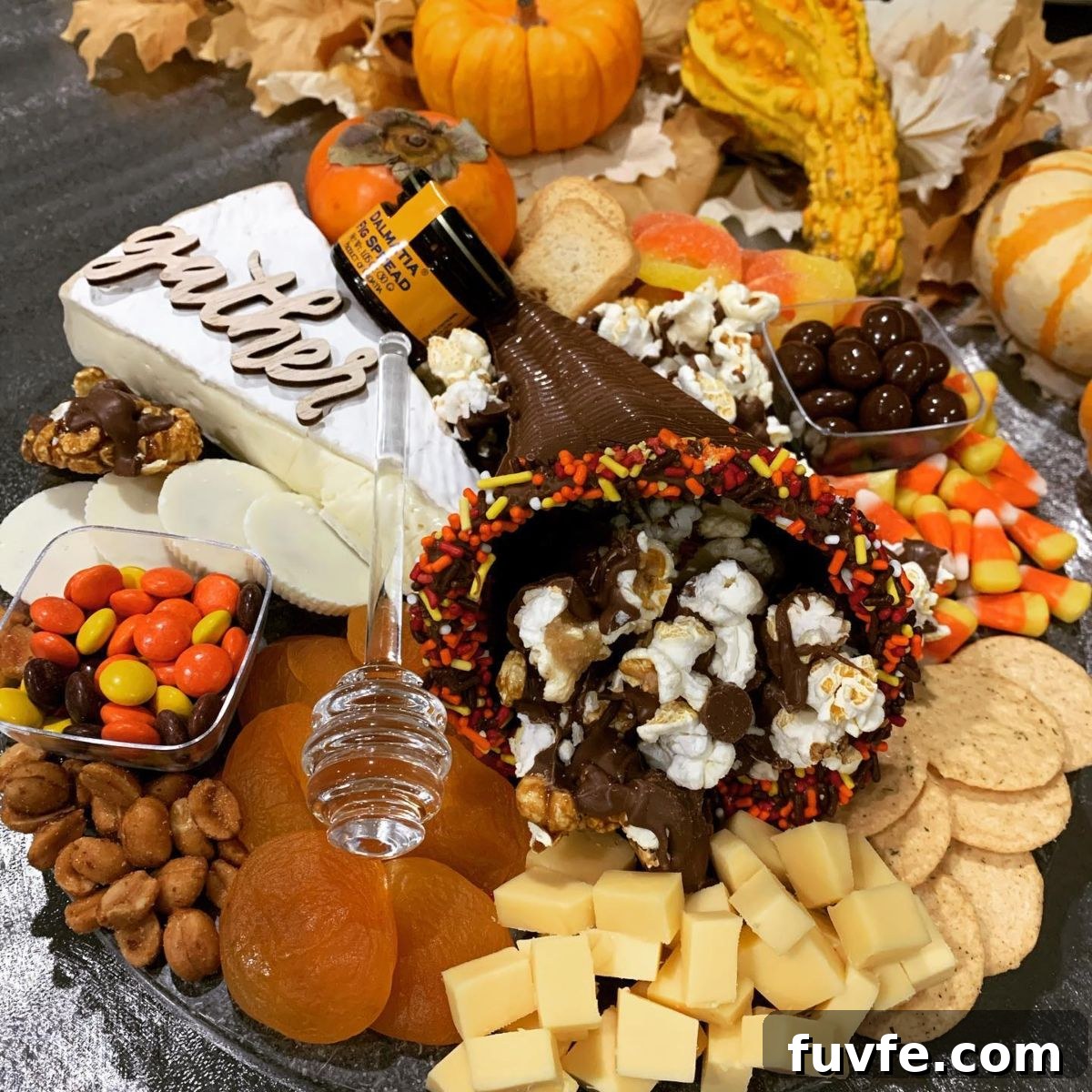 27 Gorgeous Thanksgiving Charcuterie Board Ideas for Entertaining 24 22. Chocolate Cornucopia and Popcorn Centerpiece