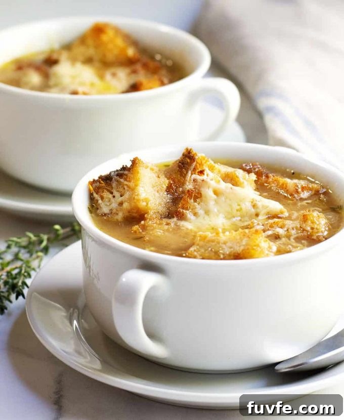 French onion soup in a mug with croutons on top