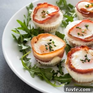 Bacon and Egg Breakfast Muffins Recipe 8 Bacon and egg muffins on a plate with arugula