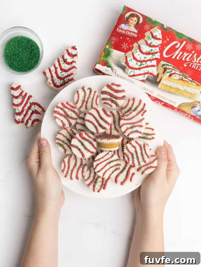 plate of cake bite cups decorated as Little Debbie Christmas tree cake