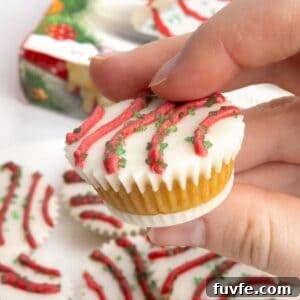 Cake ball in a mini muffin tin that does not require dipping. Decorated as Little Debbie Christmas tree cake
