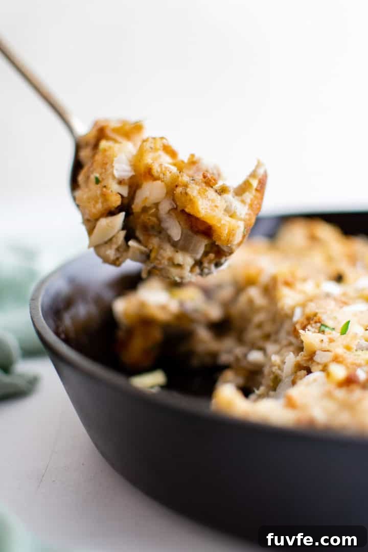 Savory Sage Stuffing Recipe for Thanksgiving and Roast Dinners 3 Savory sage stuffing on a spatula.