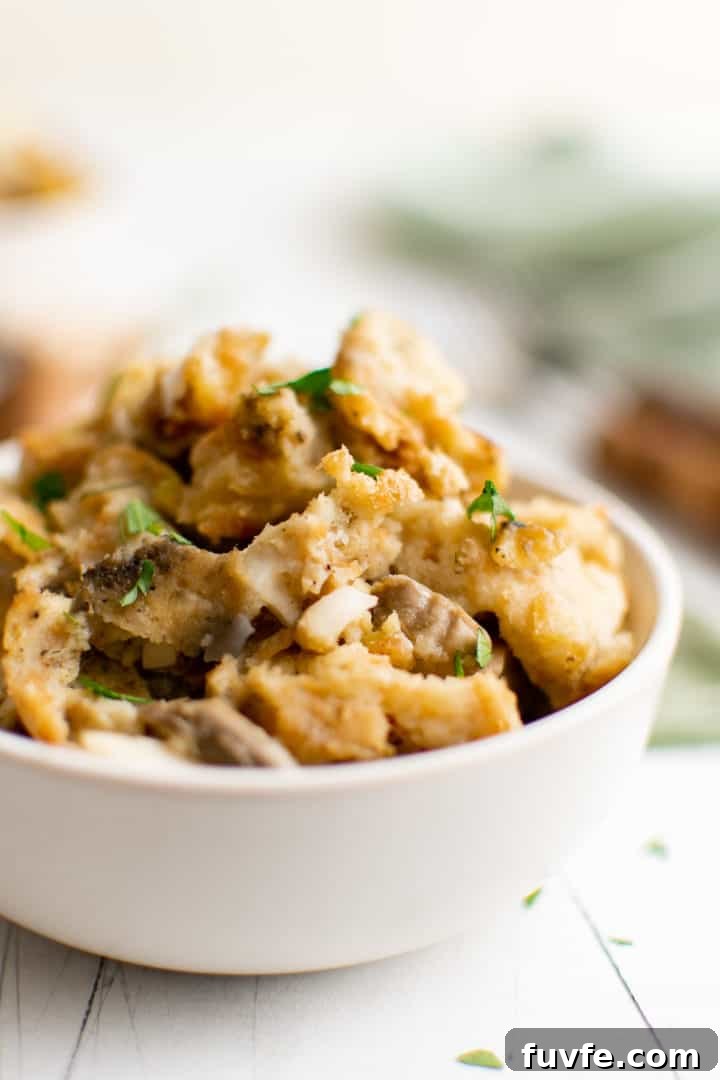Savory Sage Stuffing Recipe for Thanksgiving and Roast Dinners 8 Close up view of sage stuffing in a bowl.