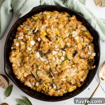 Savory Sage Stuffing Recipe for Thanksgiving and Roast Dinners 9 Overhead view of sage stuffing in cast iron.